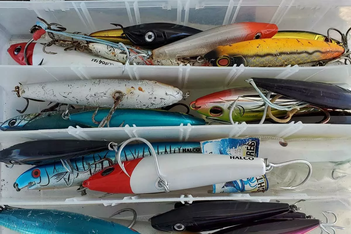 lure box filled with stickbaits for reef fishing GT's