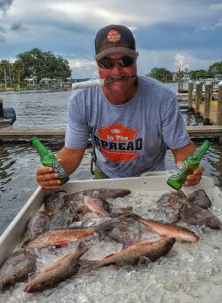 cooler full of mangrove snapper after a day of fishing in Homosassa