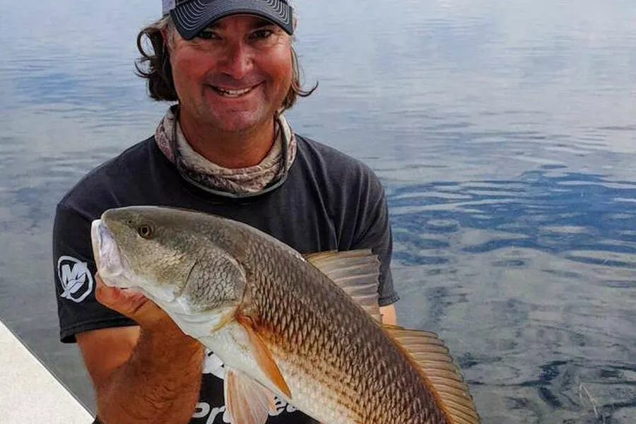 Captain William Toney with a spring redfish caught on a Nature Coast grass flat