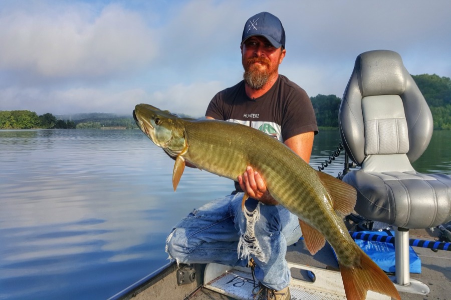 Cory Allen holding a nice musky caught trolling