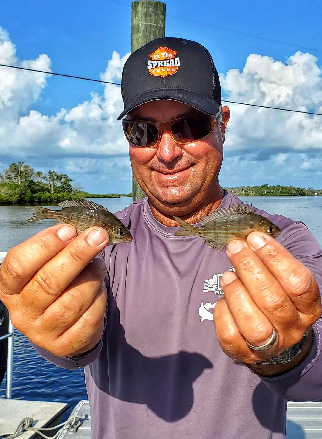 Captain William Toney holding pinfish which are one of the best baits for inshore gamefish
