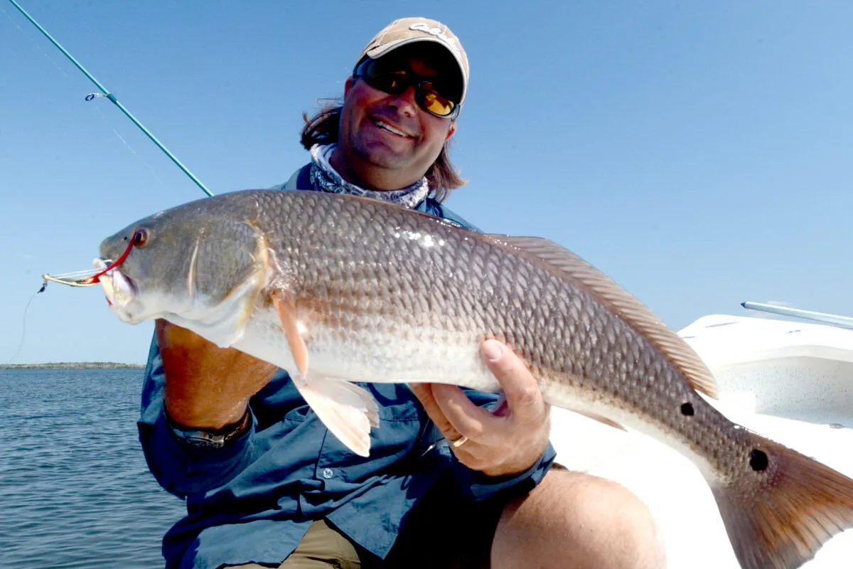 Captain William Toney with a nice redfish caught on a gold spoon