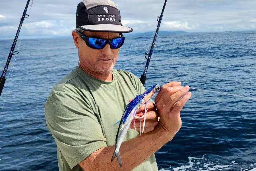 Mike Hennessy holds a skirted ballyhoo for tuna fishing