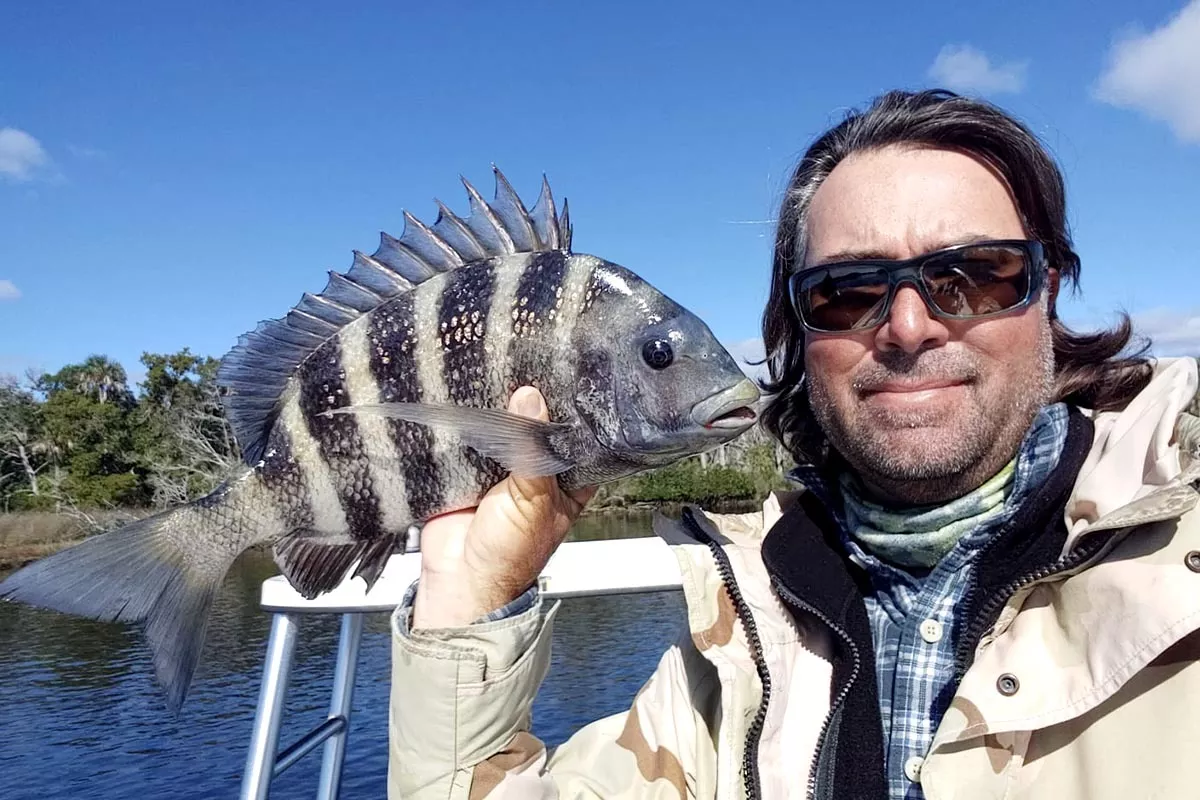 captain william toney holds a nice sheepshead fish caught in Homosassa Florida