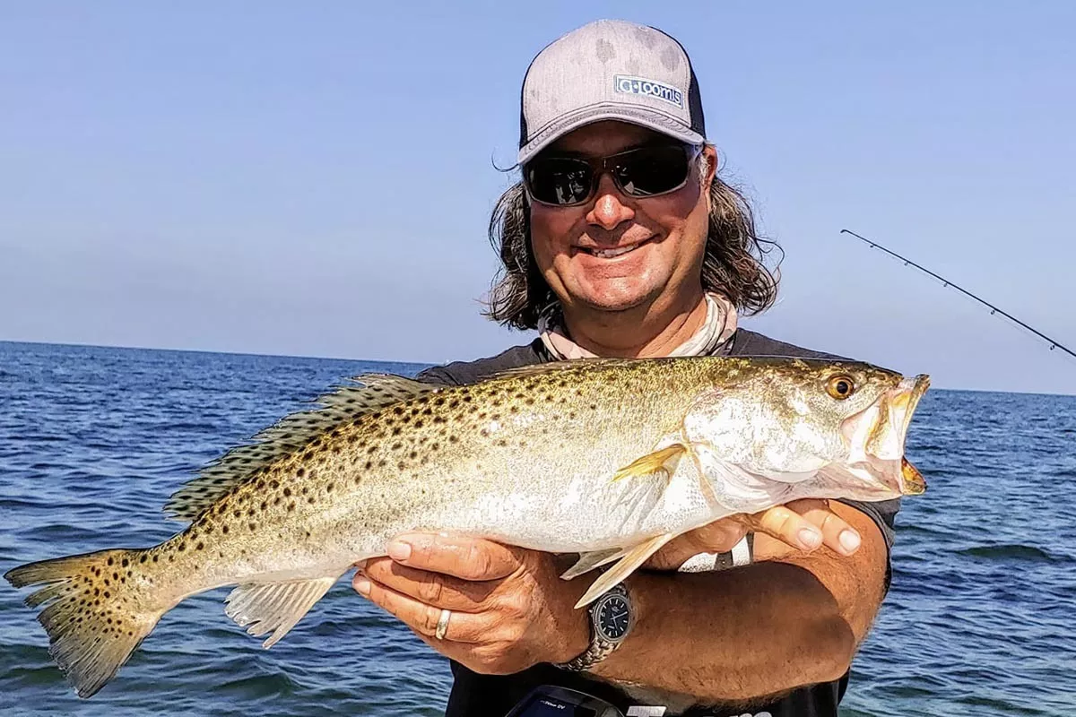 Captain William Toney holding a fat February seatrout caught on a shallow limestone flat near Homosassa, Florida