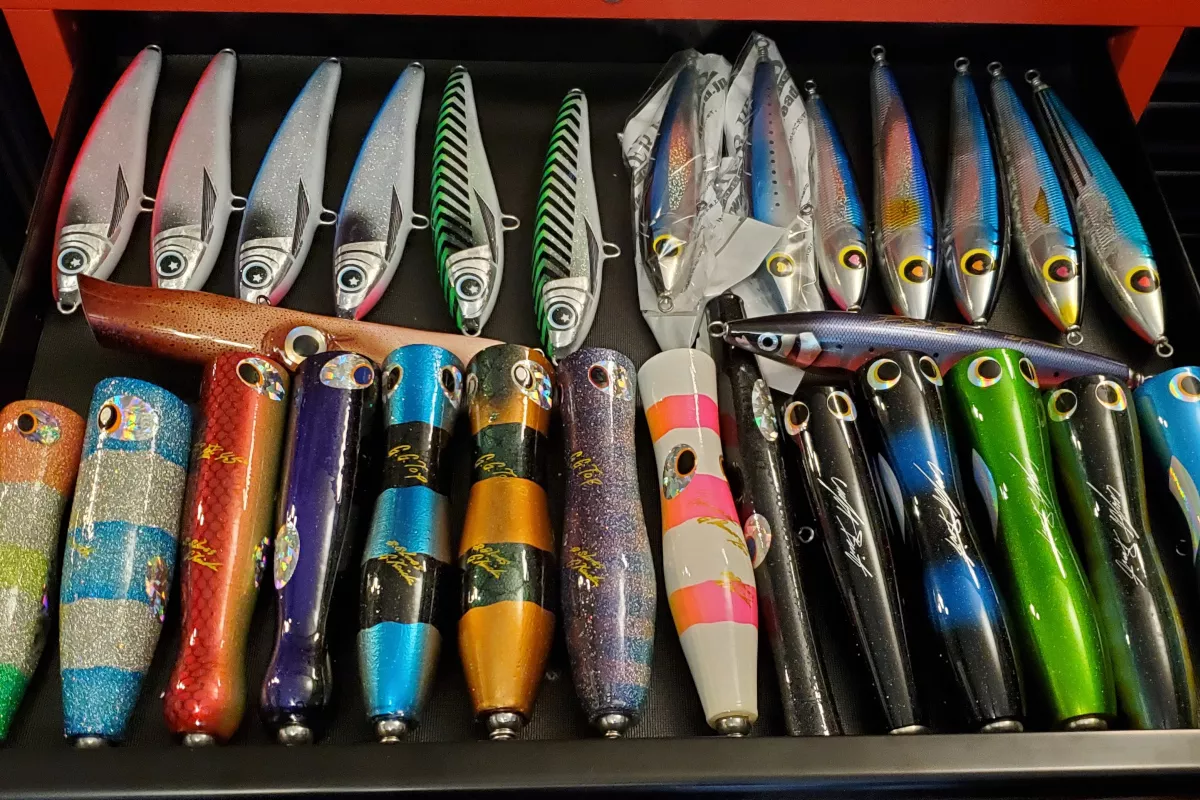 Seth Hartwick's tackle drawer full of stickbaits and poppers for giant trevally GT
