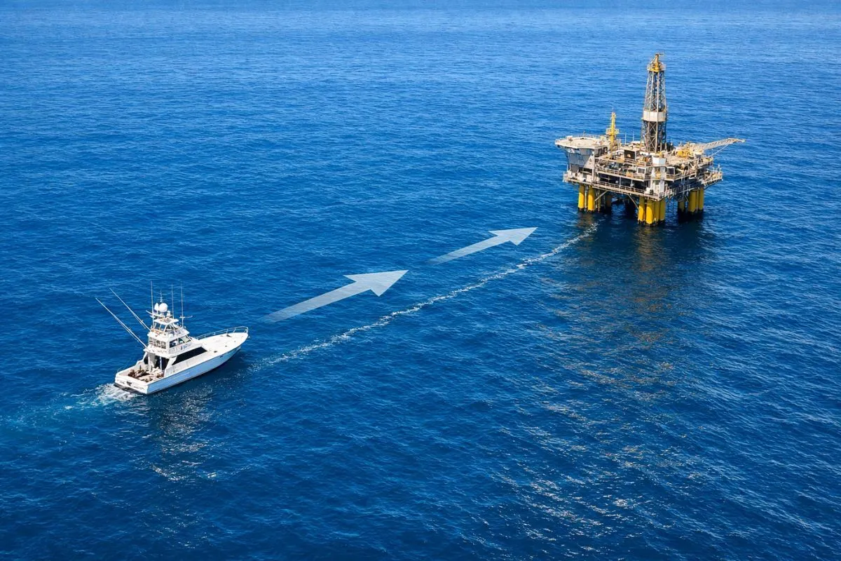 sportfishing boat positioned upcurrent of offshore oil platform