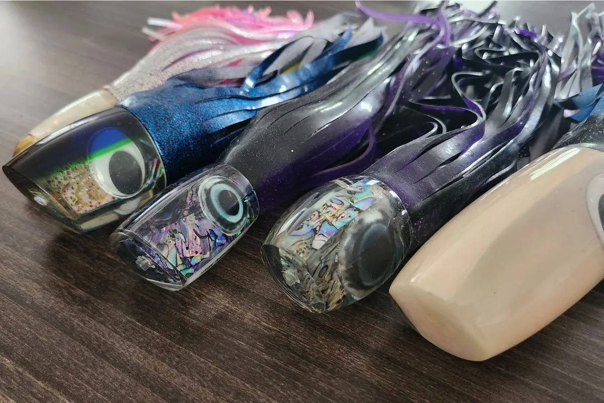 Row of skirted lure heads showing slant, bullet, plunger, and jet face shapes side by side
