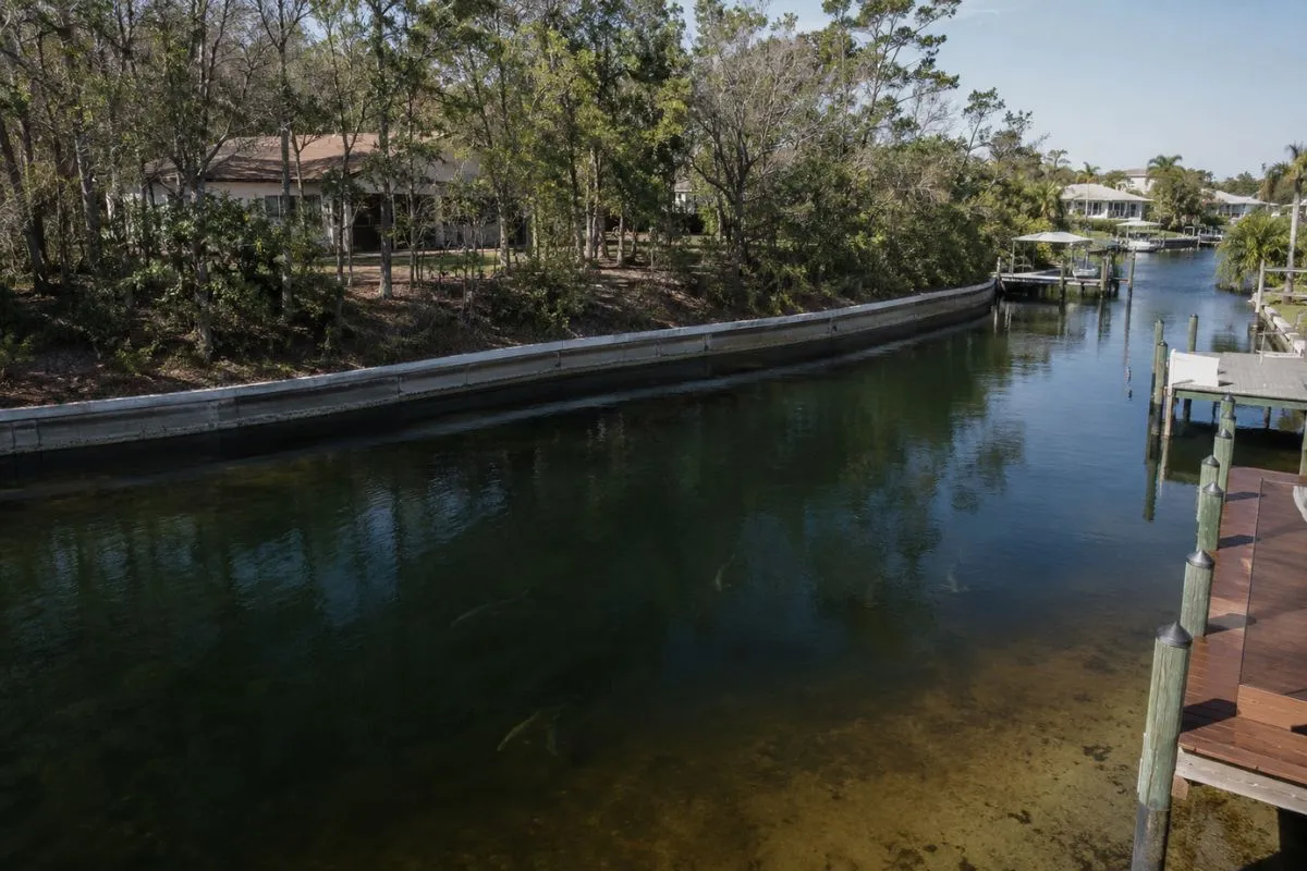 Deep Florida canal with seawall and north wind protection where winter snook hold in cold weather
