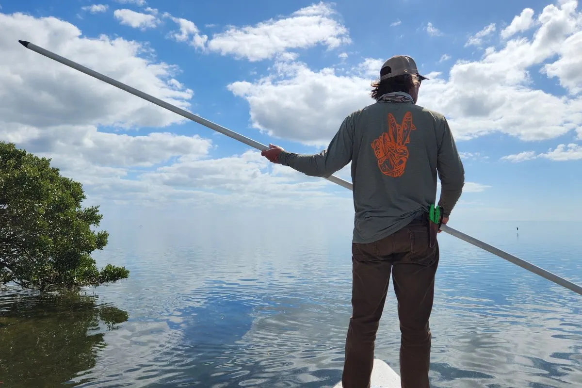 William Toney scanning a shallow grass flat for redfish