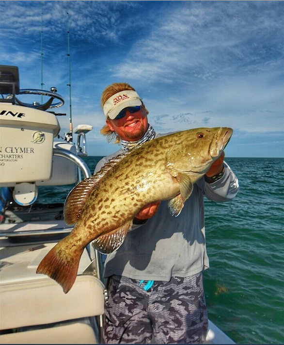 Captain Dan Clymer holding a gag grouper caught on the Nature Coast near Crystal River, Florida