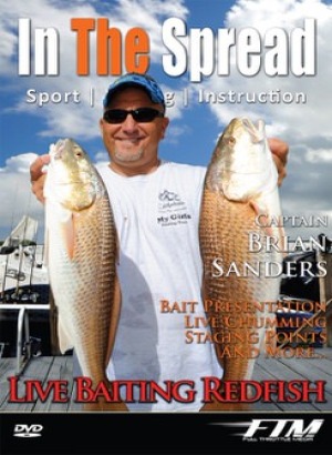 Brian Sanders holds up a couple Chokoloskee redfish
