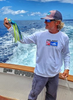 Kevin Hibbard displays a blue marlin trolling lure rigged with vinyl skirt