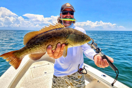 William Toney holds a Florida gag grouper caught on a diving plug