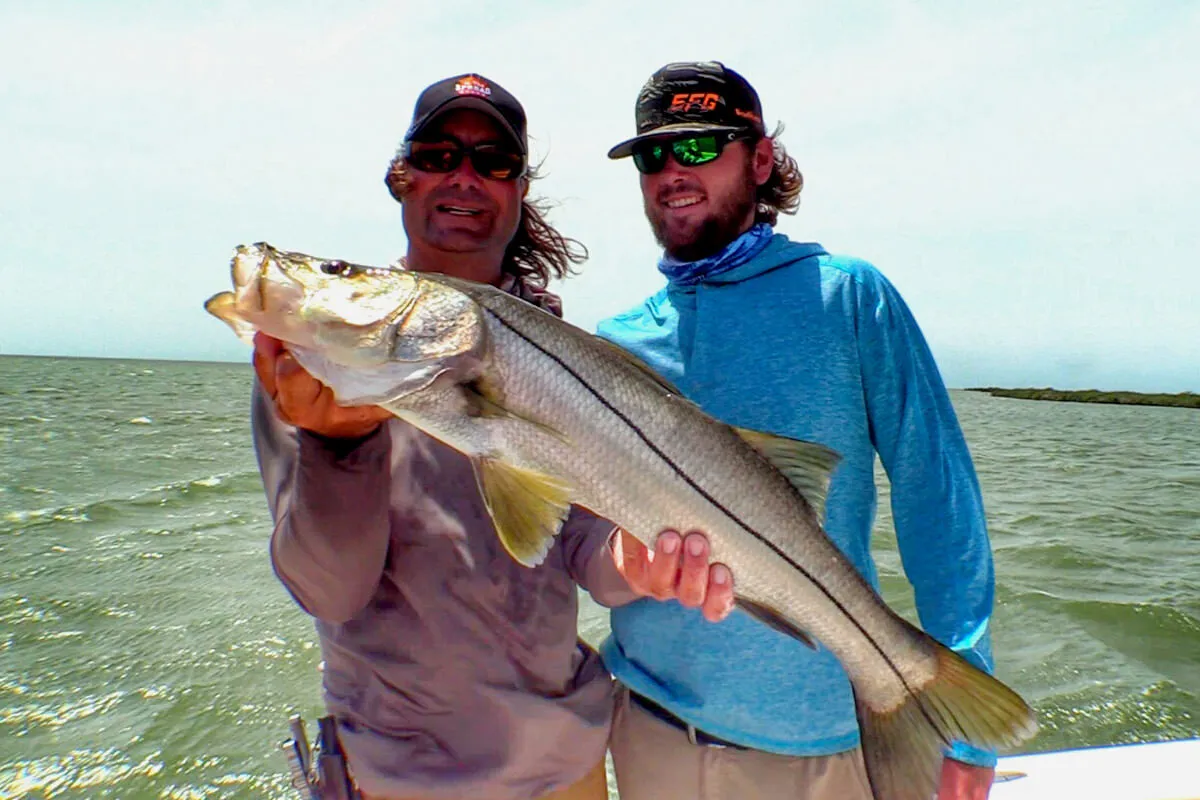 William Toney holding a nice snook caught on soft plastic lure in Homosassa