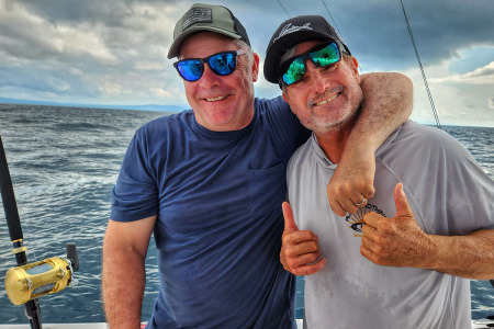 Reubin Payne and Mike Hennessy sharing a laugh while fishing in Costa Rica