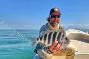 sheepshead fish held up by captain william toney
