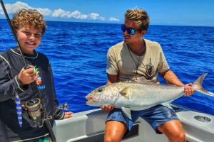 Arthur Bjontegard holds an amberjack caught vertical jigging with In The Spread