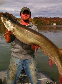 Corey Allen holding a big Tennessee musky caught in the Fall