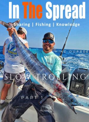 Mike Dupree reels in a wahoo while slow trolling