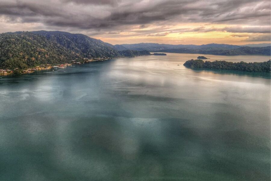 Aerial view of the Golfo Dulce surrounded by primary rainforest, Golfito visible in the background