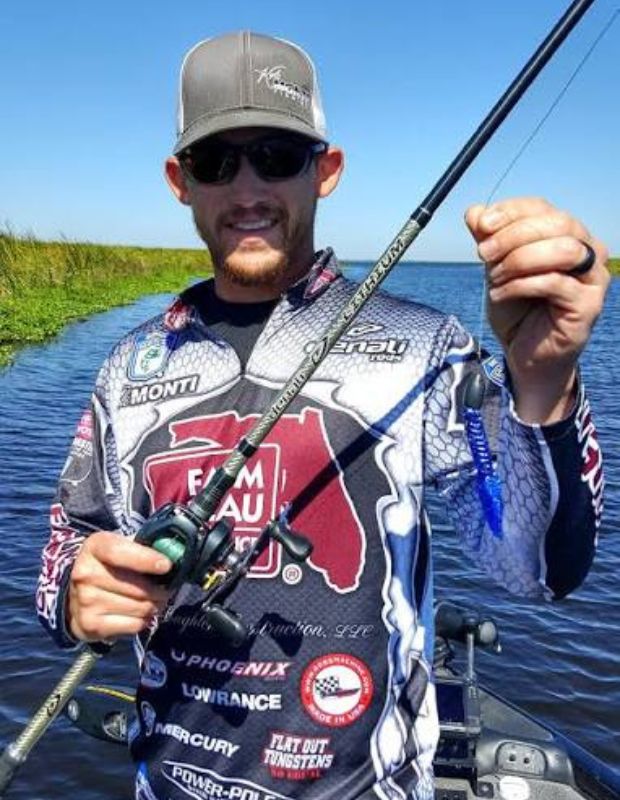 Kyle Monti, Bassmaster Elite Series pro, with a Lake Okeechobee largemouth bass in Florida